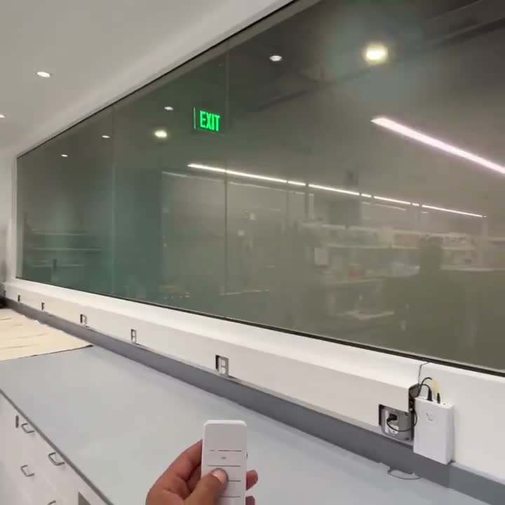 Privacy film installation on an interior office glass partition