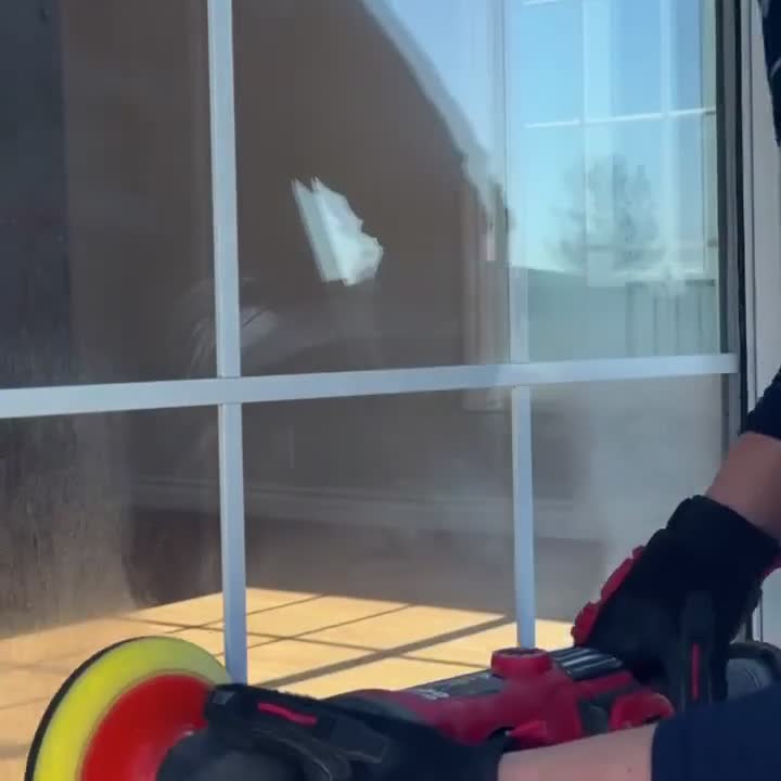 Polishing sprinkler overspray window stains off an exterior residential window
