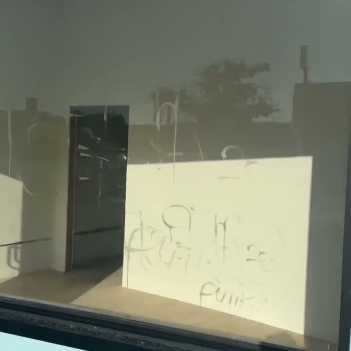 Storefront with acid etched graffiti in los angeles